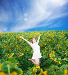 Fototapeta premium Jump among sunflowers