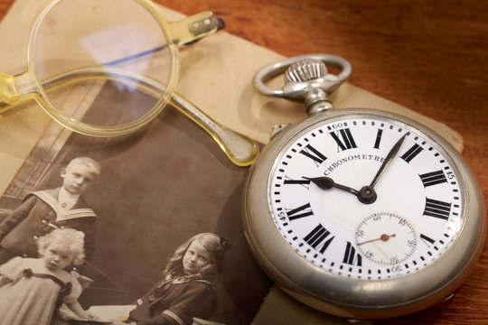 Antique pocket watch and a very old photo