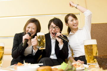 young people singing at karaoke