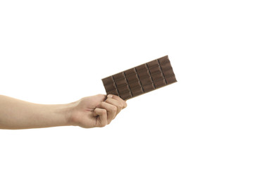 Hand holding a tablet of chocolate, isolated on white