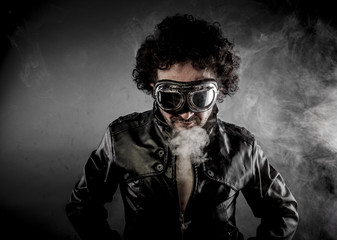 Male biker with sunglasses era dressed Leather jacket, huge smok © Outsiderzone