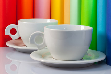 Two  ceramic cups and paper rolls