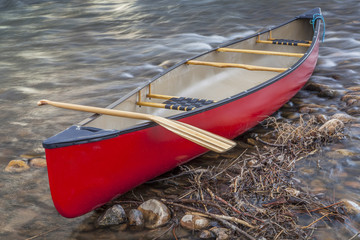 red canoe with a paddle