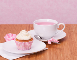 Cupcake And Fruit Tea Cup On Wooden Background