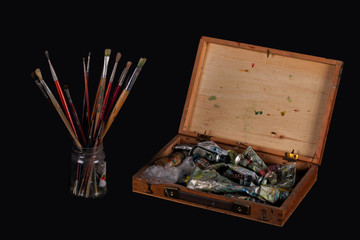 A case of oil paint and brushes