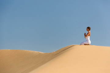 Fototapeta na wymiar Yoga meditation on the beach, healthy female body in peace