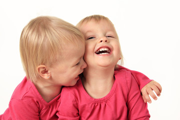 Little twin girls laughing