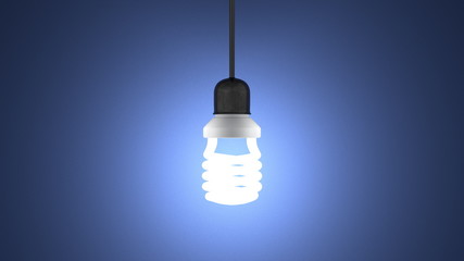 Glowing spiral light bulb hanging on blue