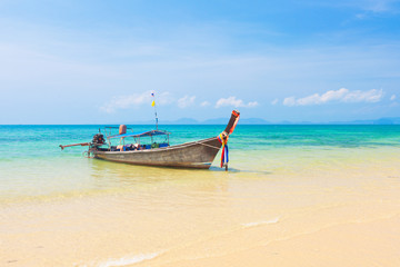Naklejka na ściany i meble Long tail boat on tropical beach, Krabi, Thailand