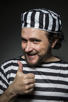Imprisoned, Desperate, portrait of a man prisoner in prison garb