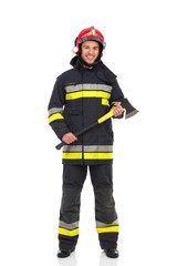Firefighter posing with axe.