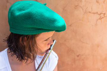Girl practices music notes with flute wind instrument
