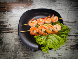 Shrimp shashlik on a binrage background