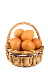 eggs in a wicker basket isolated