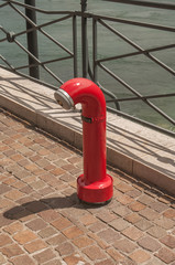 A single red hydrant at the Geneva street