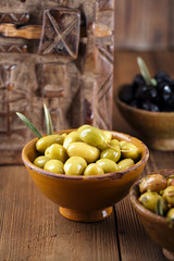 marinated Olives in bowls with moroccan  ornament on wood