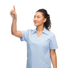 smiling doctor or nurse pointing to something