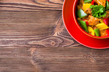 Delicious goulash on wooden table