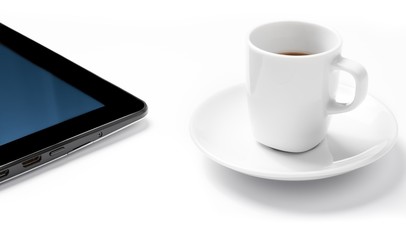 Fototapeta na wymiar digital tablet pc near cup of coffee, concept of new technology