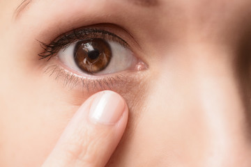Fototapeta premium Close up of a contact lens in an eye