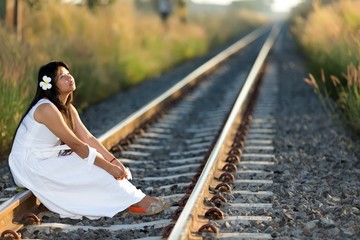 Beautiful young Thai woman meditating