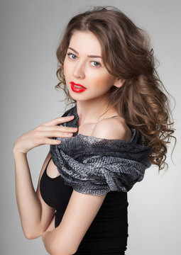 pretty woman wearing scarf -studio shot on grey background