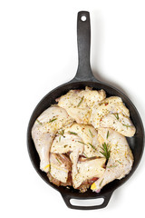 Raw chicken meat with rosemary and lemon ready to bake