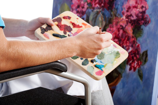 Painter in a wheelchair
