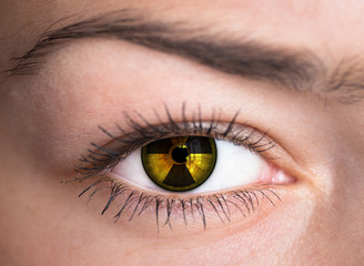 Human eye with radiation hazard symbol - concept photo.
