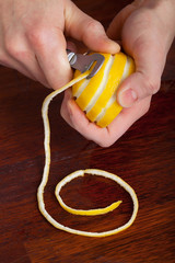 Slicing lemon with citrus decoration knife