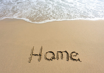 home word drawn on beach