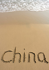 china word drawn on beach