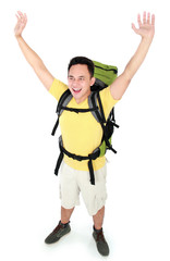 male hiker with backpack raised his arm