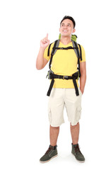 male hiker with backpack pointing up