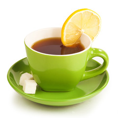 cup of tea with lemon and sugar cubes