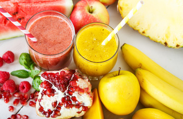 Fresh organic red and yellow smoothie with apple, watermelon, po