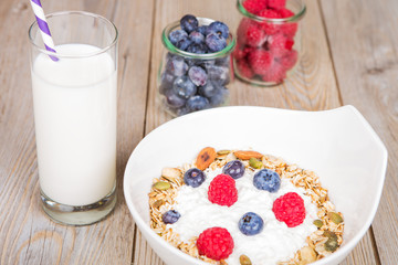 Fresh yoghurt with home made cereals and muesli, fresh raspberry