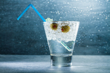 Gin Cocktail with crushed ice and olives