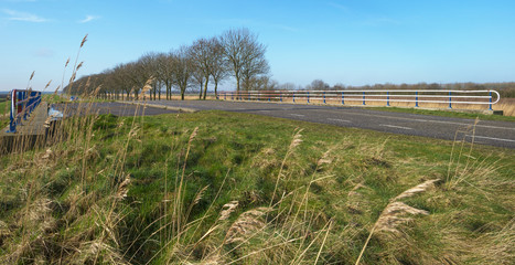 Countryside road over a bridge in winter
