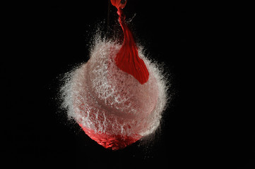 Red balloon with water exploded