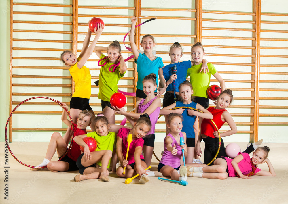 Wall mural group of little happy gymnasts