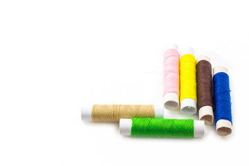 Sewing threads multicolored isolated on white background.