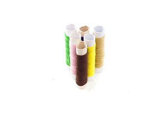 Fototapeta na wymiar Sewing threads multicolored isolated on white background.