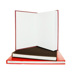 Open book on top of two books