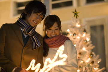 couple looking at illumination of Christmas