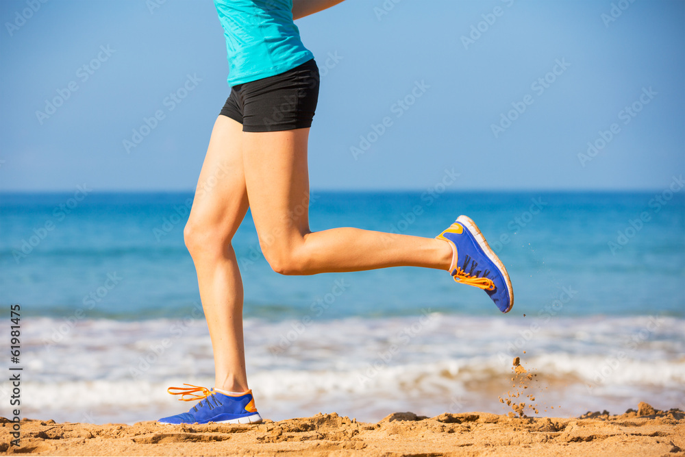 Wall mural woman running on the beach