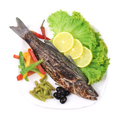 Grilled seabass on plate.