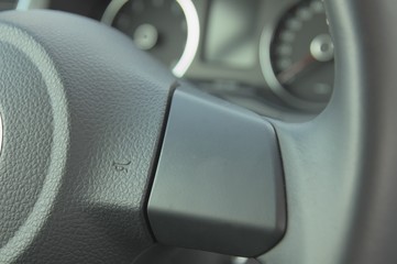 Symbol of warn on steering wheel in car.