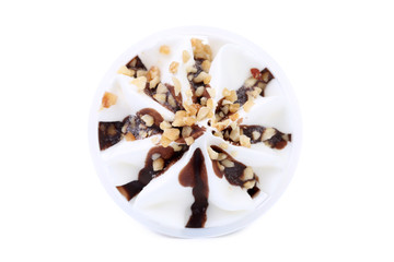 Soft ice cream with chocolate and nuts.