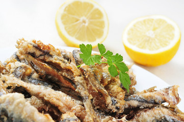 spanish boquerones fritos, battered and fried anchovies typical